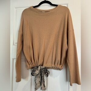 Tan long sleeve light Sweater shirt. Cinched waist with snake skin bow.